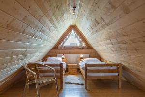 Posteľ alebo postele v izbe v ubytovaní Apartament KROKUS