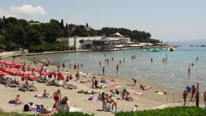 a group of people on a beach in the water at Cvit Jadrana in Split