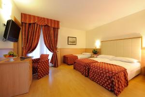 Кровать или кровати в номере Club Hotel e Residence La Vela