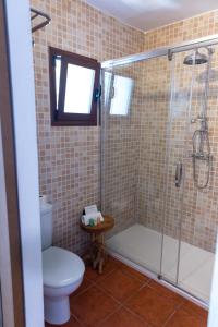 a bathroom with a toilet and a shower at Hostal La Torre Ibiza Cap Negret in San Antonio