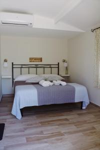 Un pat sau paturi într-o cameră la Agriturismo San Leonardo