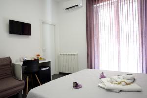 TV a/nebo společenská místnost v ubytování Amuri Room&Suite