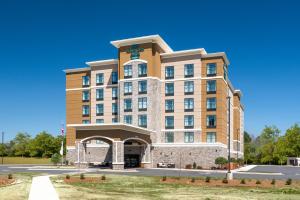 uma representação da frente do hotel em Homewood Suites By Hilton Fayetteville em Fayetteville