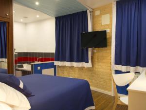 TV a/nebo společenská místnost v ubytování Hotel A. G. Porcillan