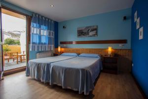 Postel nebo postele na pokoji v ubytování Hotel A. G. Porcillan