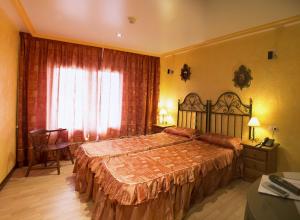 Postel nebo postele na pokoji v ubytování Hotel A. G. Porcillan