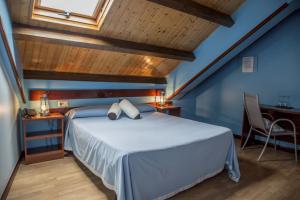 Postel nebo postele na pokoji v ubytování Hotel A. G. Porcillan