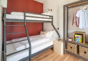 a bedroom with two bunk beds and a ladder at Staycity Aparthotels Dresden City Centre in Dresden +32 photos