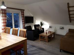 a living room with a couch and a table at Ferienhaus Aloisia in Sankt Michael im Lungau