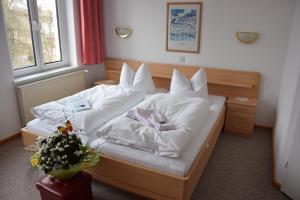 Postel nebo postele na pokoji v ubytování Hotel Nordlicht
