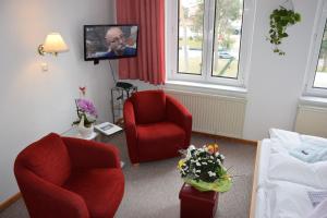 TV a/nebo společenská místnost v ubytování Hotel Nordlicht