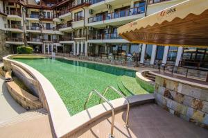 a swimming pool in the middle of a building at Apartment Balchik in Balchik