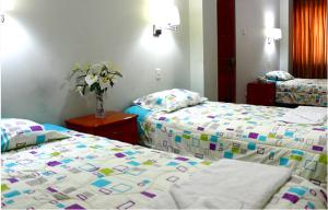 Postel nebo postele na pokoji v ubytování Hostal Residencial Lino