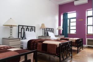 Postel nebo postele na pokoji v ubytování NY Moore Hostel