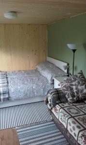 Postel nebo postele na pokoji v ubytování Tiny house Ružēni
