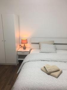 Postel nebo postele na pokoji v ubytování Apartment CHEZ TONY