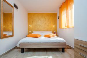 Postel nebo postele na pokoji v ubytování Apartment and Studio Tereza