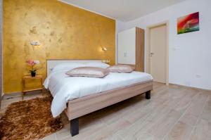 Postel nebo postele na pokoji v ubytování Apartment and Studio Tereza