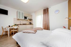 Postel nebo postele na pokoji v ubytování Apartment and Studio Tereza