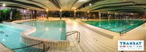 a large swimming pool in a large building at La Nouvelle Criqueboise in Criquebeuf-en-Caux
