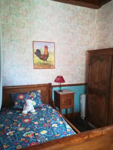 a bedroom with a bed with a teddy bear on it at La Tour de Seythenex in Seythenex