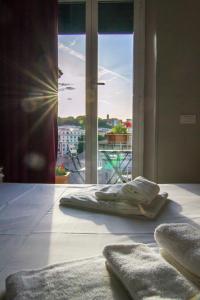 A bed or beds in a room at Top Floor Trastevere