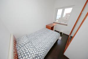 Łóżko lub łóżka w pokoju w obiekcie Apartmani Postimana