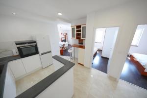 Kuchnia lub aneks kuchenny w obiekcie Apartmani Postimana