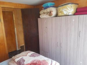 Postel nebo postele na pokoji v ubytování Cabaña Tongariki