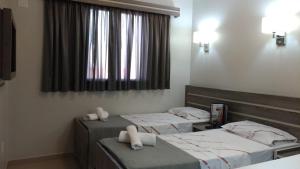 Postel nebo postele na pokoji v ubytování Brasilia Parque Hotel + 45 fotografií