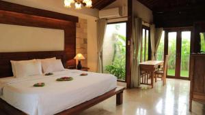 Ένα ή περισσότερα κρεβάτια σε δωμάτιο στο Intan Mutiara Sanur Beach Villa +157 φωτογραφίες