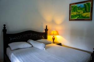 Postel nebo postele na pokoji v ubytování Putu Guest House