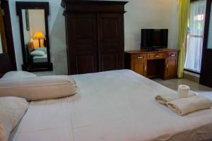 Postel nebo postele na pokoji v ubytování Putu Guest House
