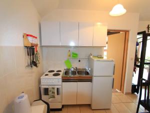 Kuchyň nebo kuchyňský kout v ubytování Apartment GIARDINO