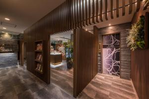 a lobby of a bookstore with wooden walls at Restay Onoji (Adult Only) in Machida