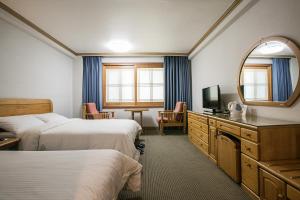 Postel nebo postele na pokoji v ubytování Busan Tourist Hotel