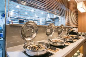 Kuchyň nebo kuchyňský kout v ubytování Busan Tourist Hotel