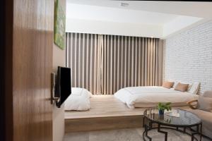TV a/nebo společenská místnost v ubytování Tianli Hotel