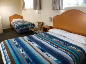 Postel nebo postele na pokoji v ubytování Sheffield Motor Inn