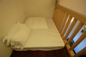 Postel nebo postele na pokoji v ubytování Mei Man Slide Homestay