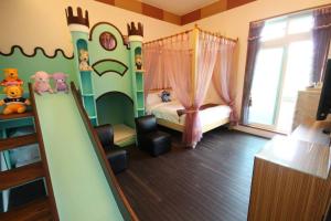Postel nebo postele na pokoji v ubytování Mei Man Slide Homestay