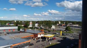 a view of a parking lot with a gas station at MR Apartments in Vaasa