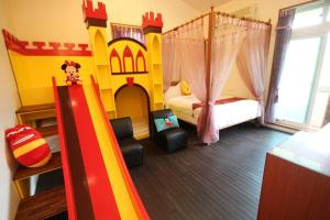 Postel nebo postele na pokoji v ubytování Mei Man Slide Homestay