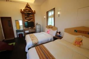 Postel nebo postele na pokoji v ubytování Mei Man Slide Homestay