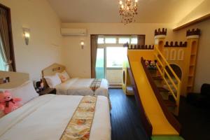 Postel nebo postele na pokoji v ubytování Mei Man Slide Homestay