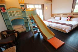 Postel nebo postele na pokoji v ubytování Mei Man Slide Homestay