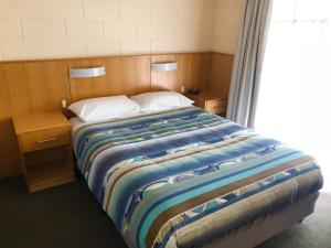 Postel nebo postele na pokoji v ubytování Sheffield Motor Inn