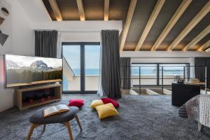 a living room with a flat screen tv and a couch at Residence Delta in Cavtat