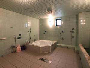 Kylpyhuone majoituspaikassa Hotel Xenia Takinoyashiro
