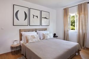 En eller flere senge i et værelse på Villa Majavec